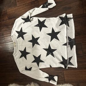 Cute white sweater with black stars. Great for fall!